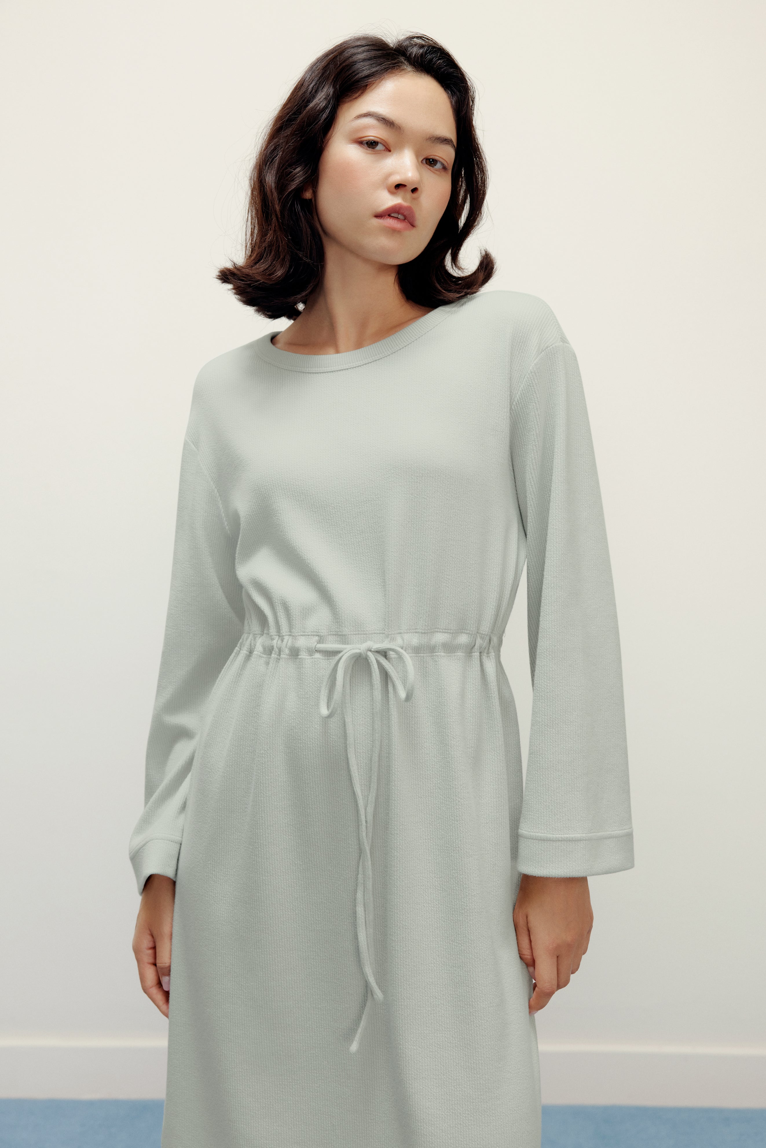 woman in mint pajama longe sleeve dress with waist drawstring