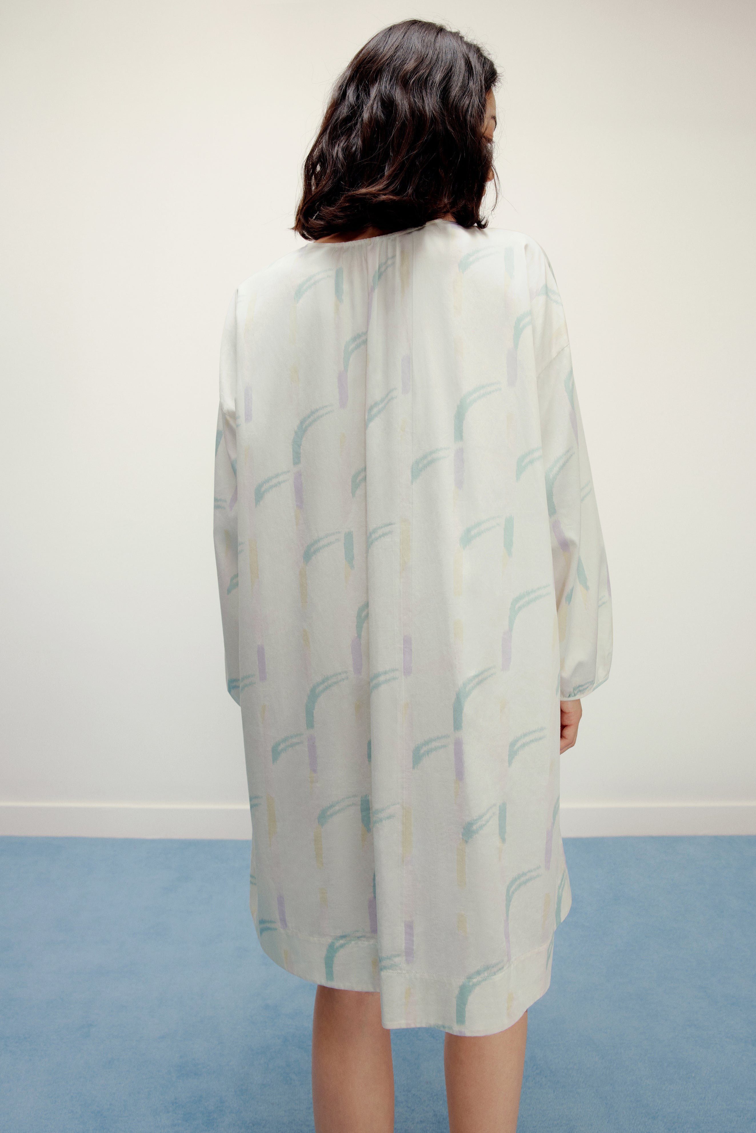 back of woman wearing a ruched dress
