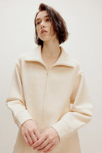woman with off white zip up jacket