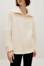 woman with off white jacket