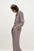 woman wearing purple pajama set