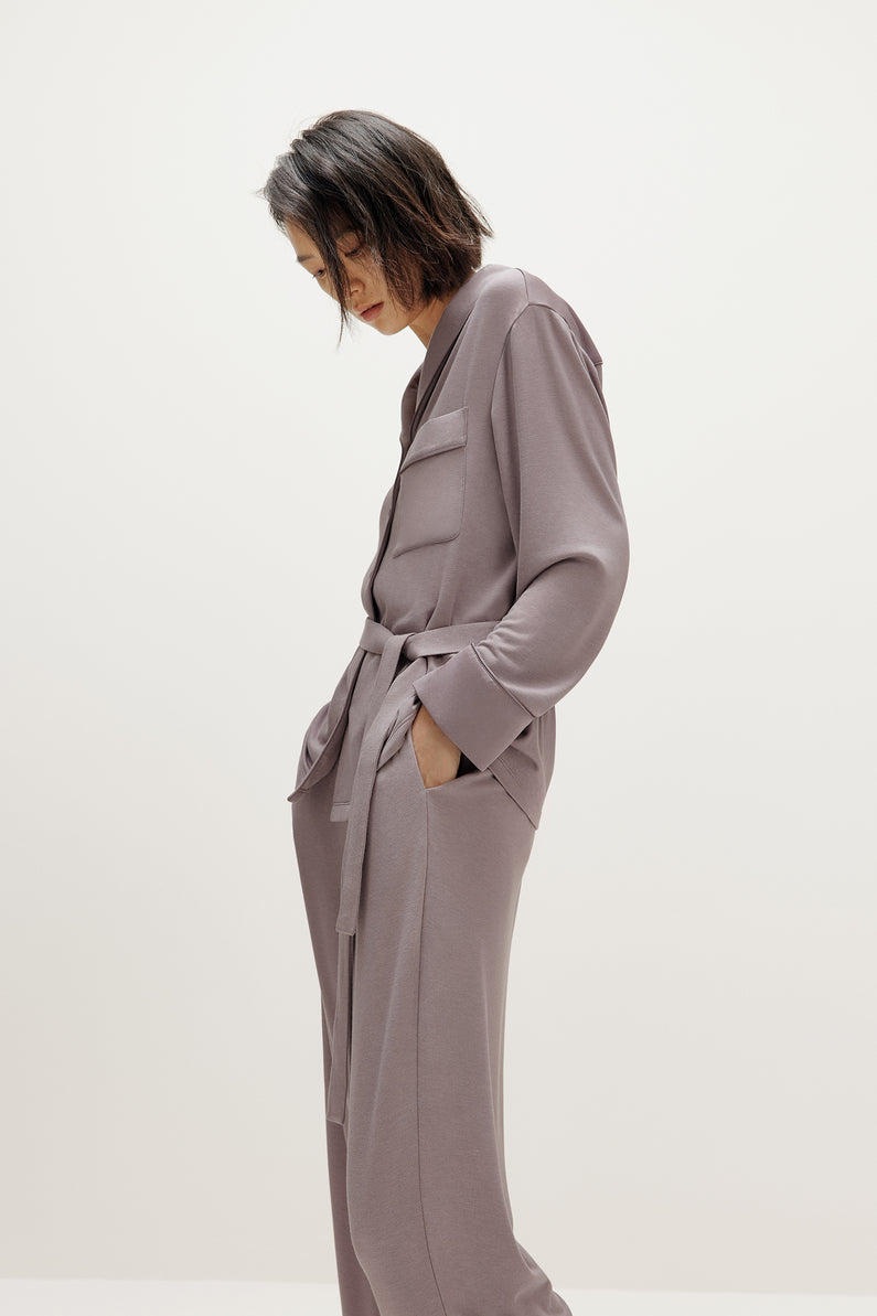 woman wearing purple pajama set