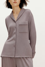 woman wearing purple pajama set