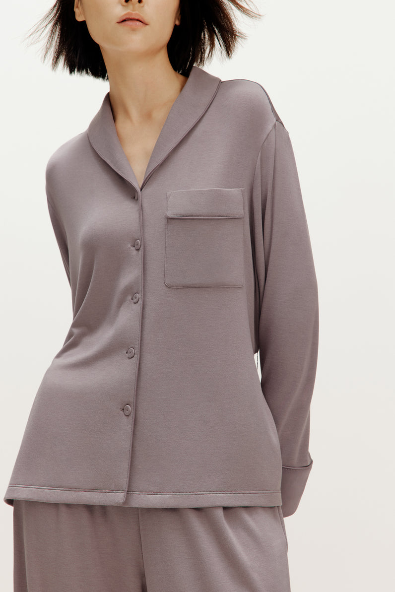 woman wearing purple pajama set