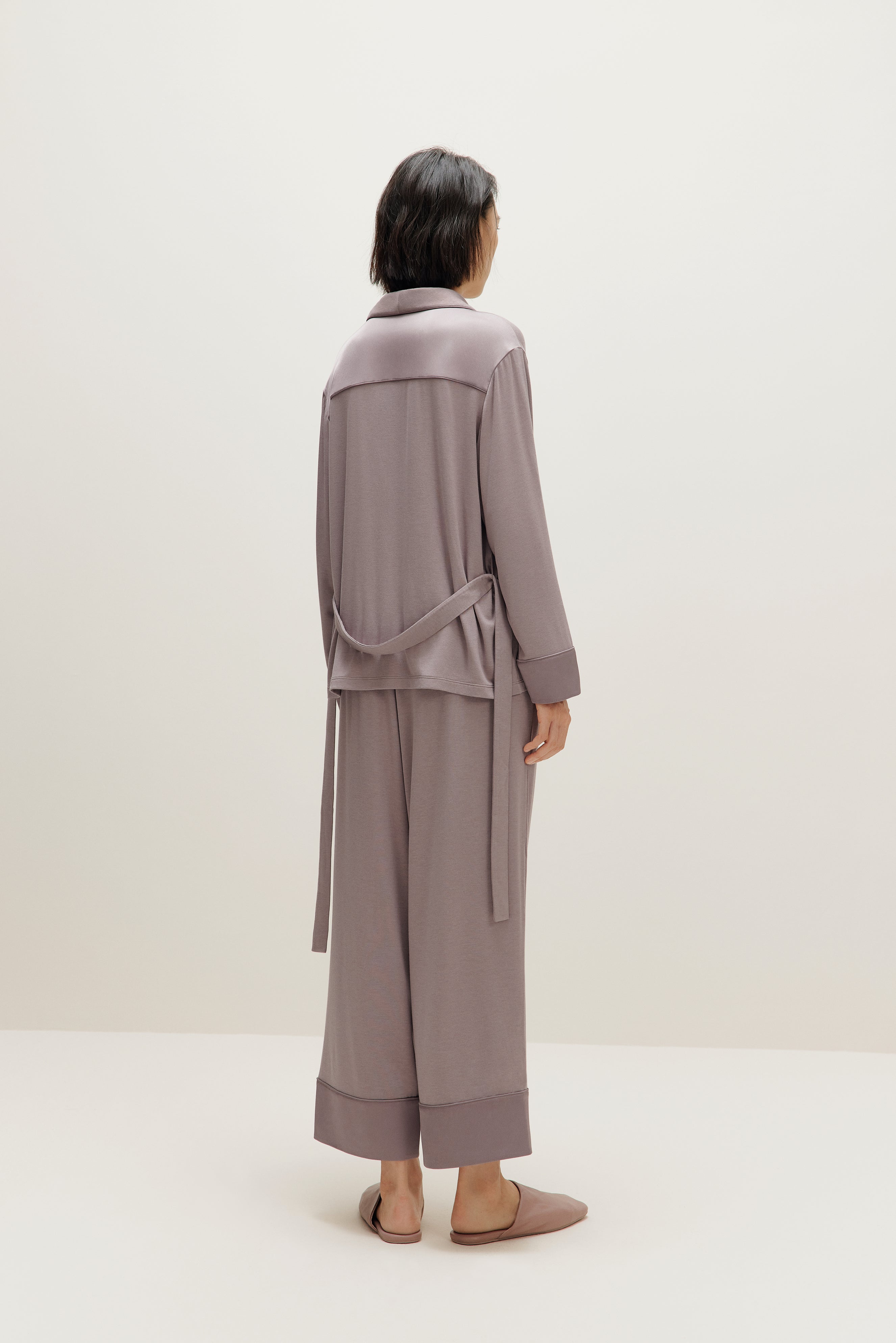 woman wearing purple pajama set back