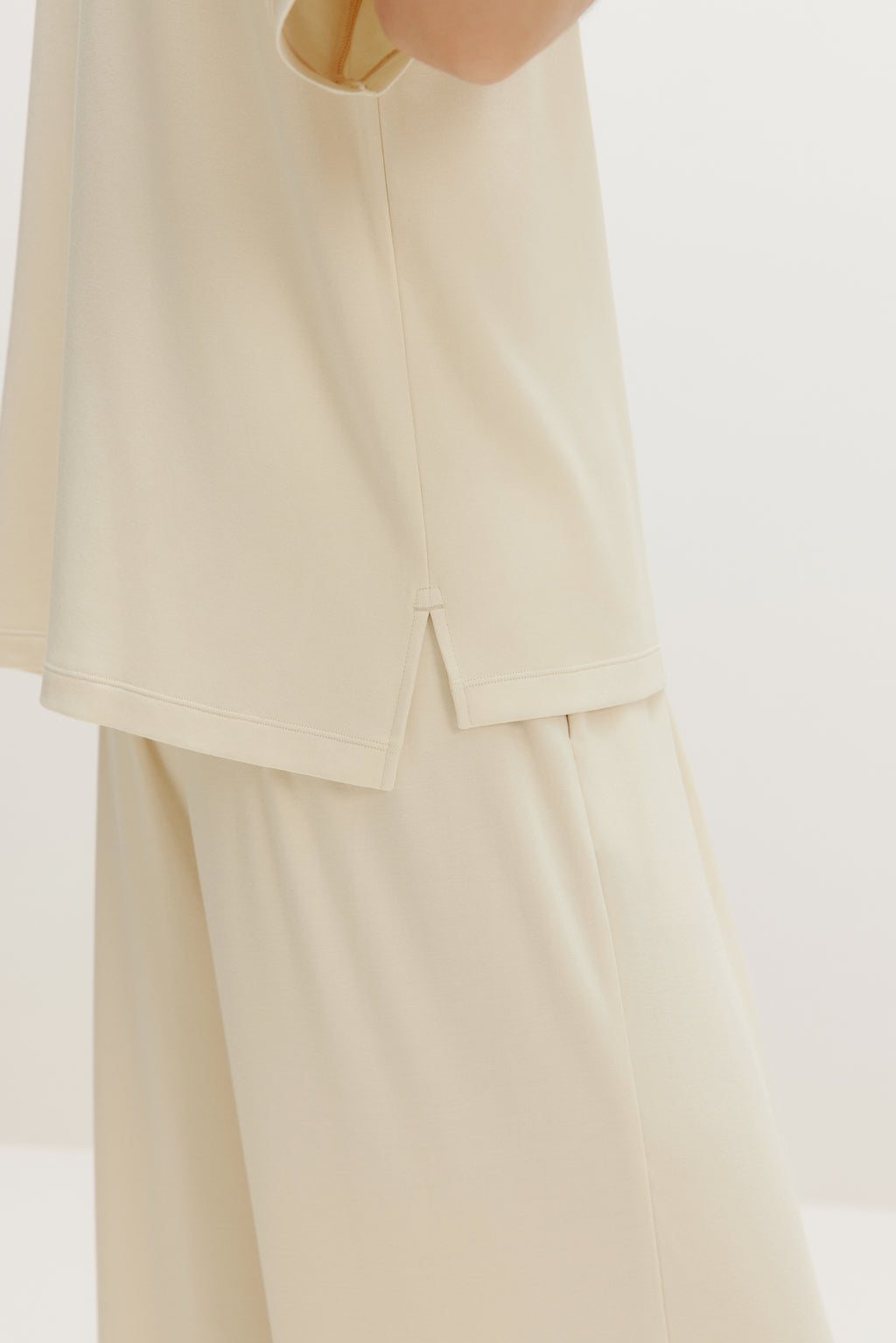 side close up of cream pajama t-shirt