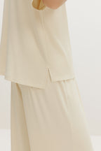 side close up of cream pajama t-shirt