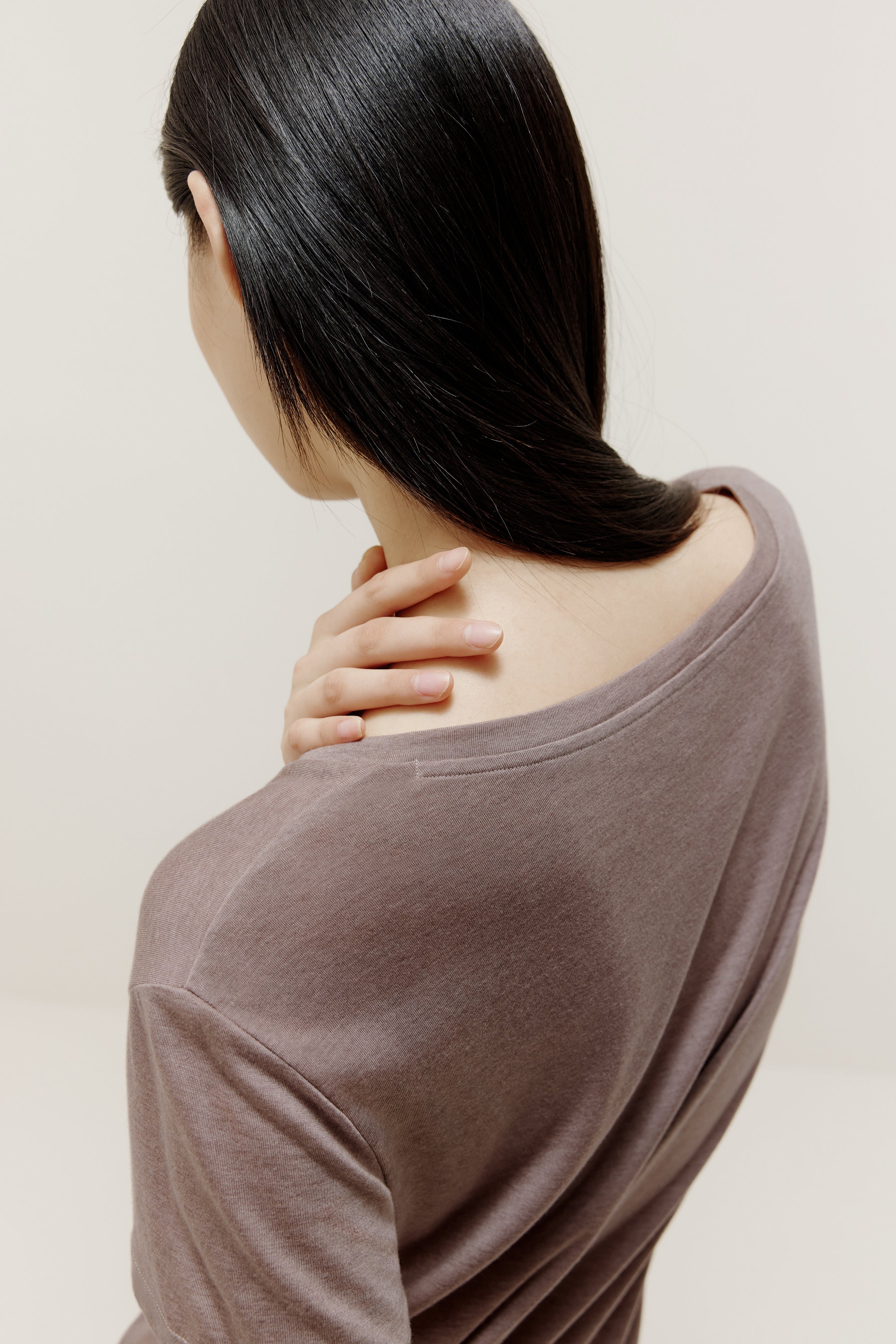 back of the short sleeve drape-front sweater