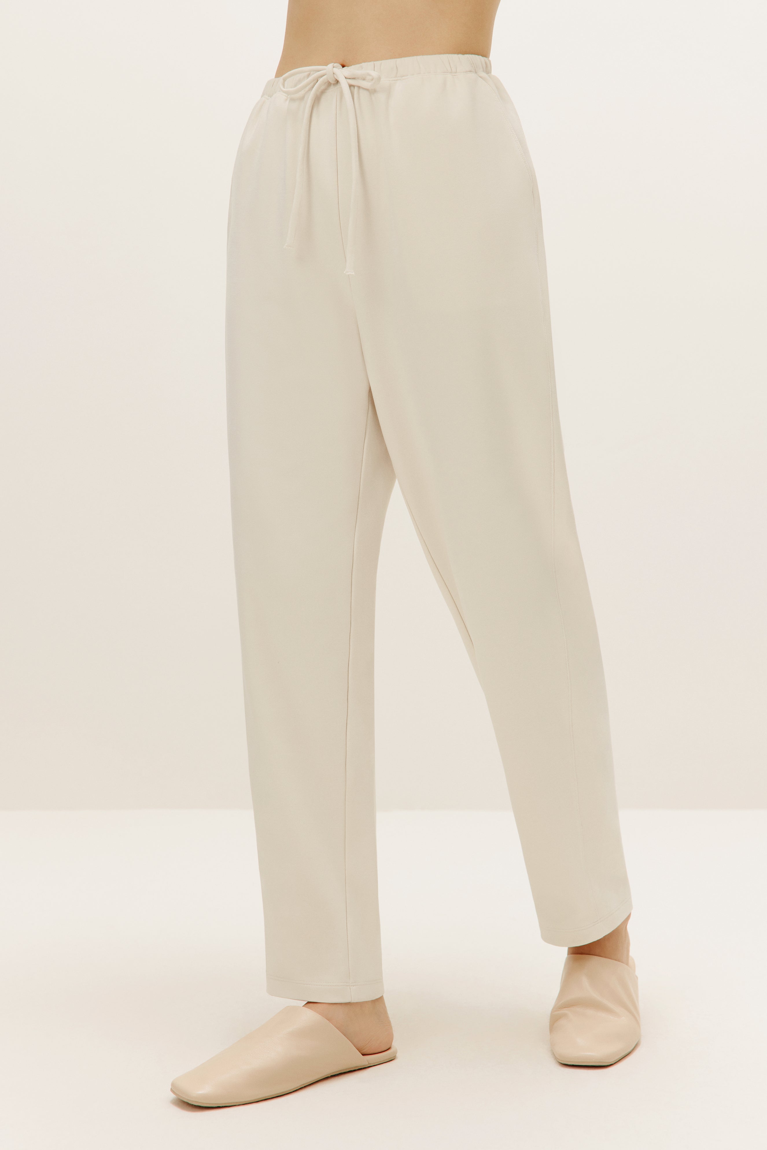 a pair of cream color pants 