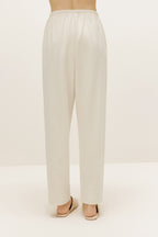 a pair of cream color pants  from back