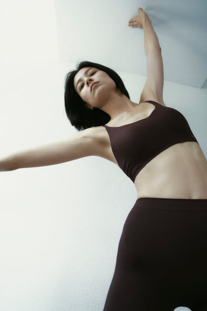 woman in brown bra and shorts