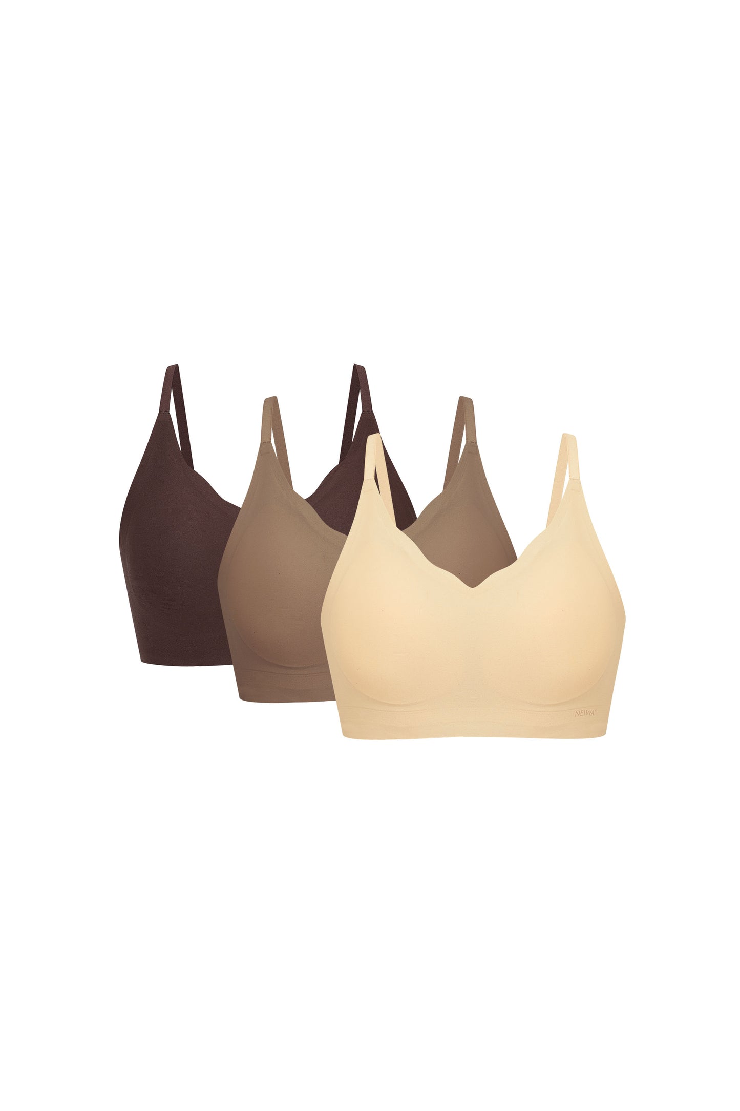 Flat lay image of beige, light brown, and dark brown bras
