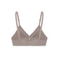 Interior flat lay of purple grey bra with plunge neckline, center cutout, and back clasp 