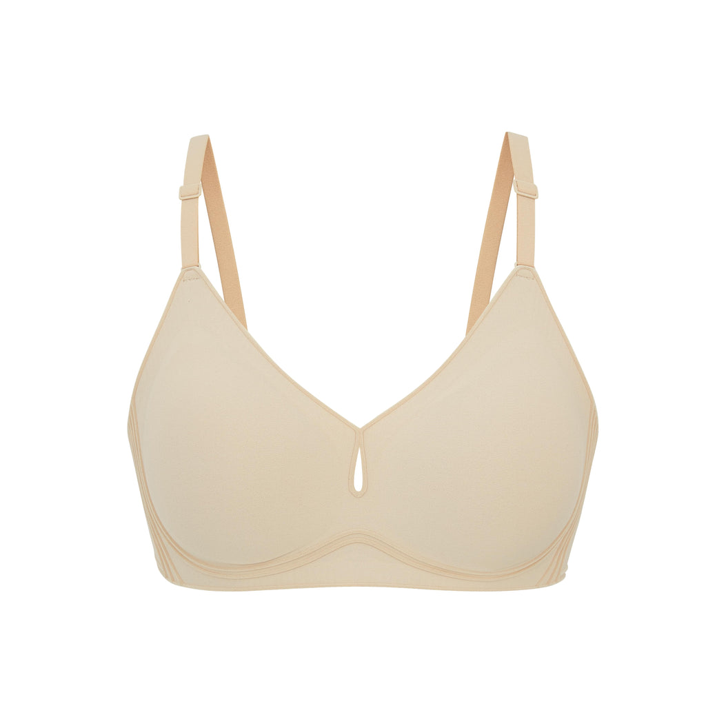 Flat lay image of beige bra with plunge neckline and center cutout. Brazilian Sand color. 