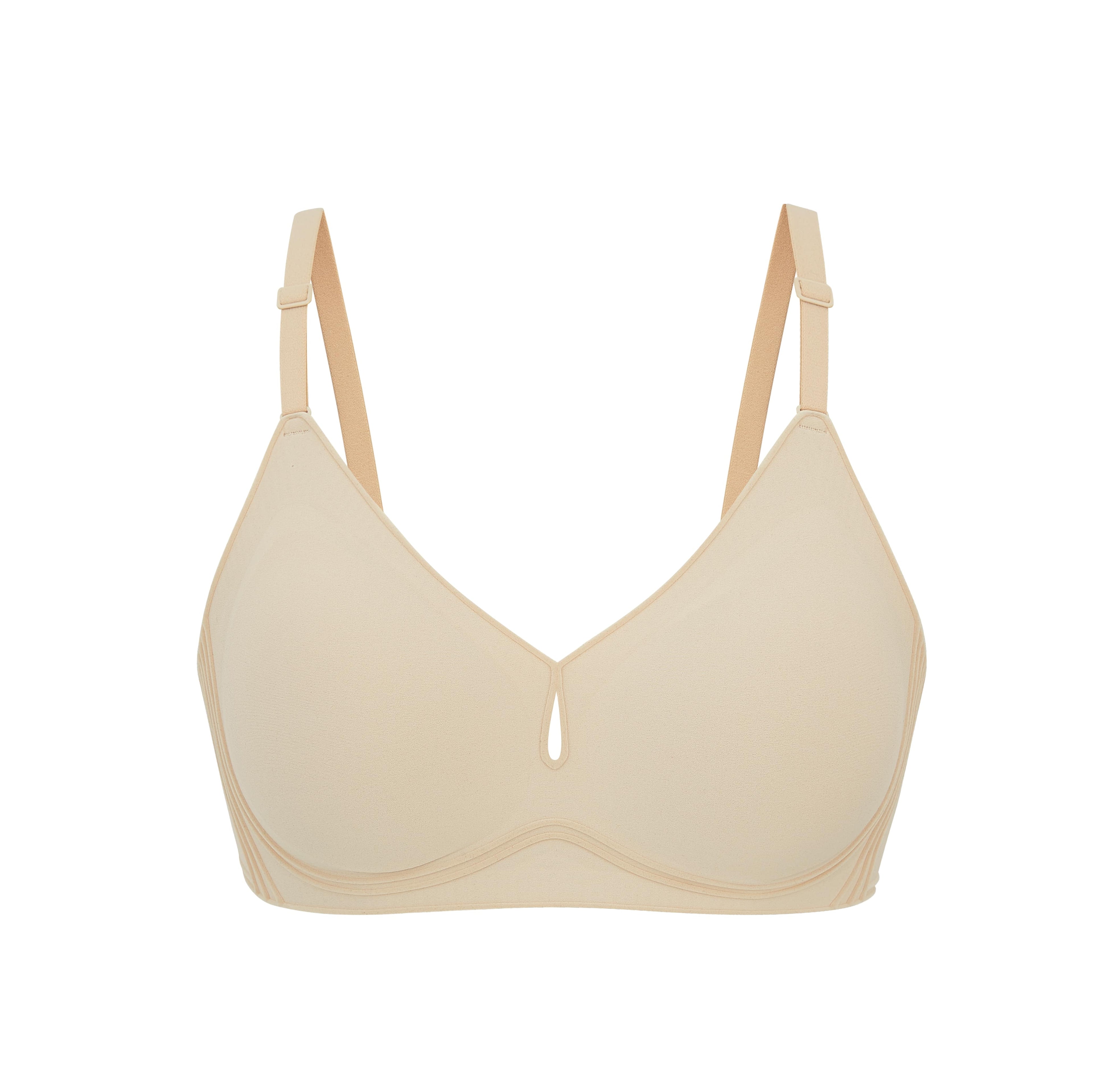 Flat lay image of beige bra with plunge neckline and center cutout. Brazilian Sand color. 