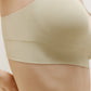 a close look of the side of a cream color bra