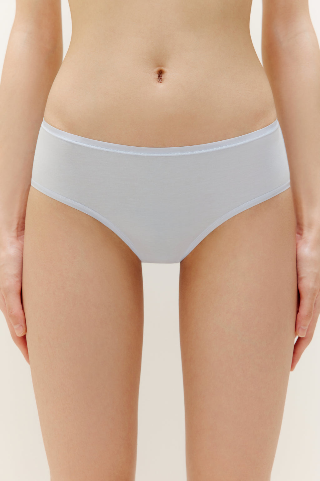 A woman wearing a blue brief