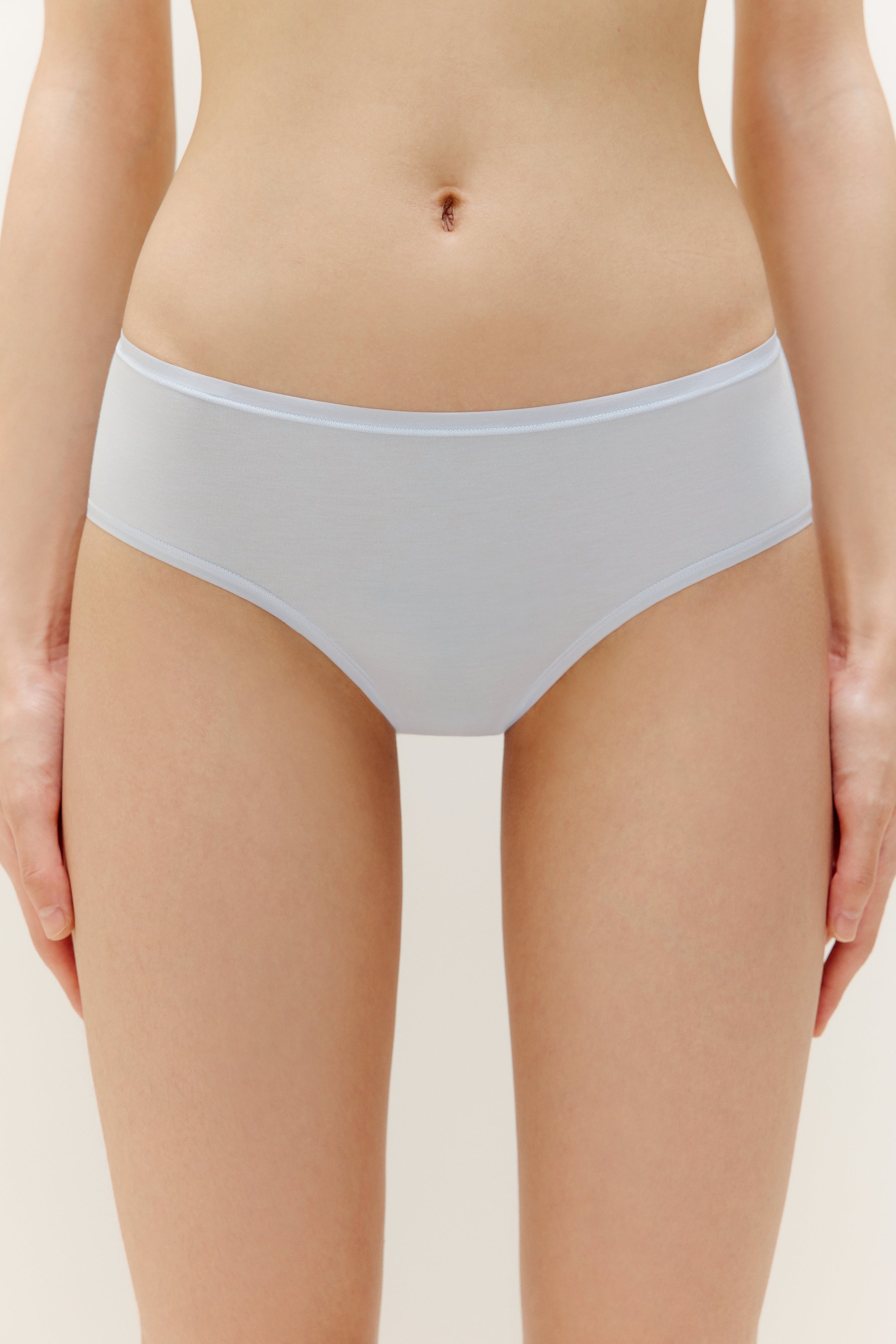 A woman wearing a blue brief