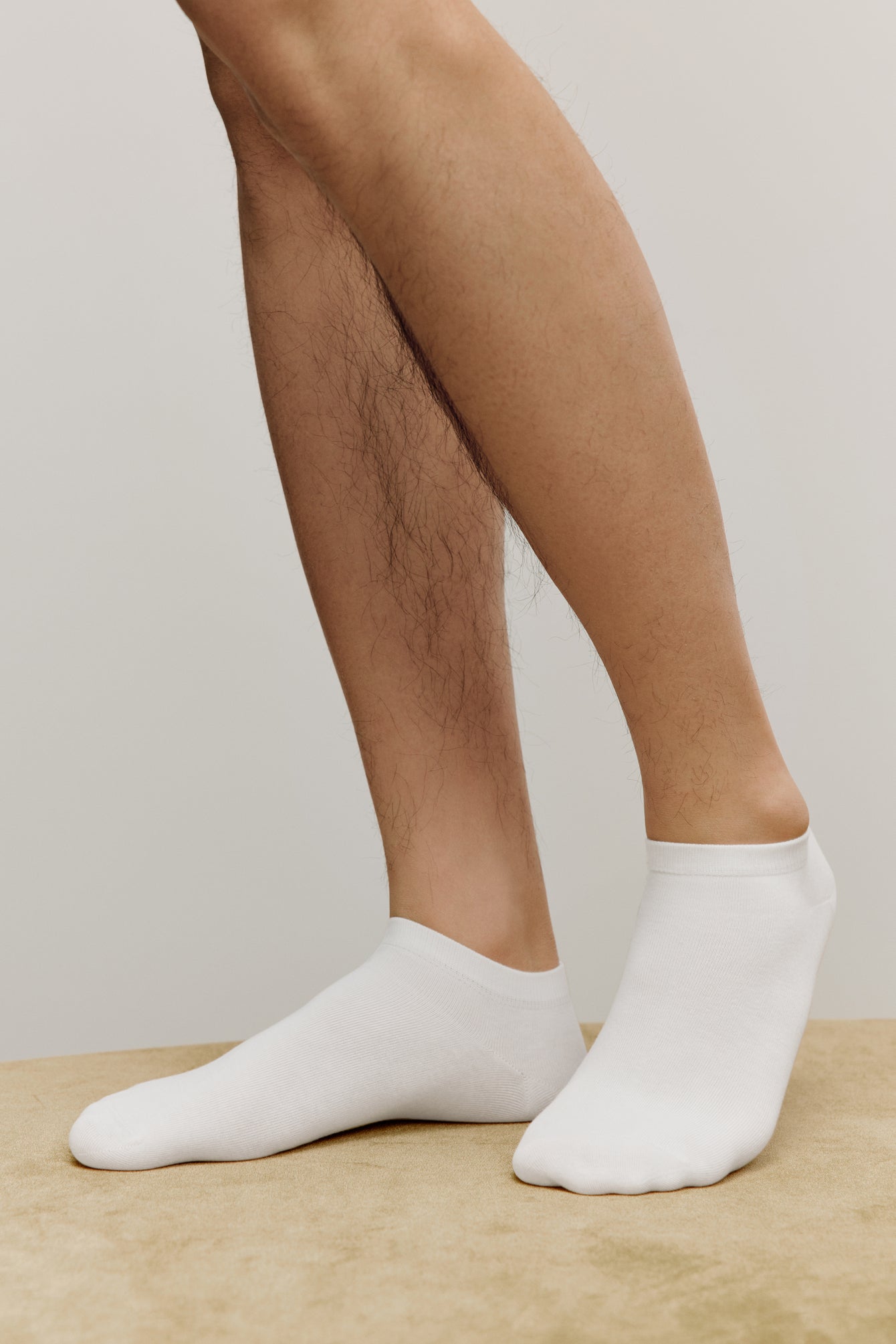side view of a person wearing white socks