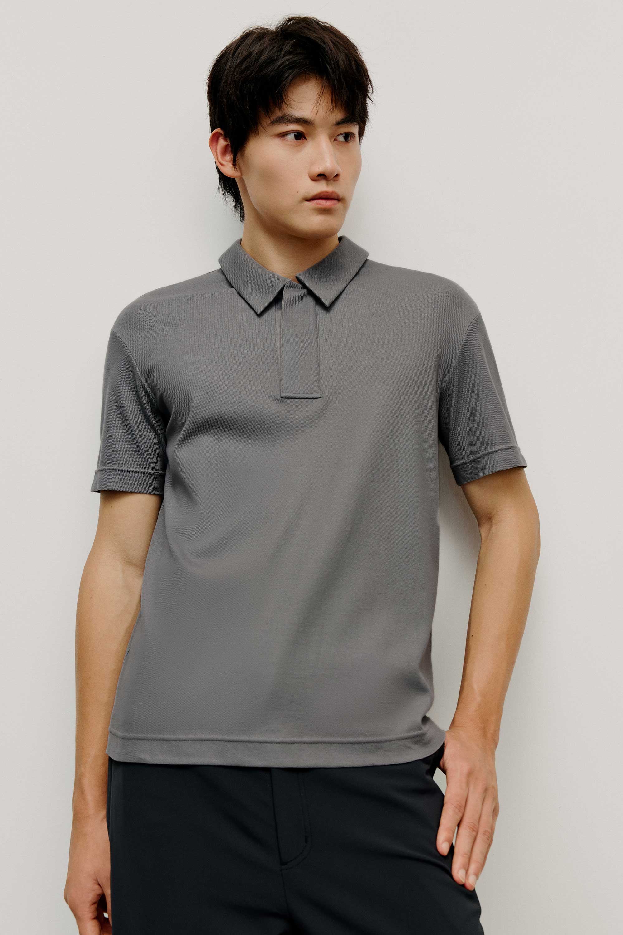 Man in grey polo shirt