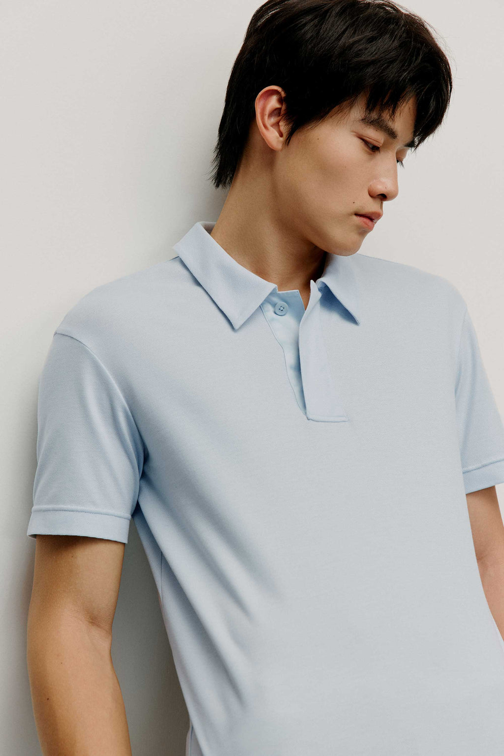 Man in blue polo shirt