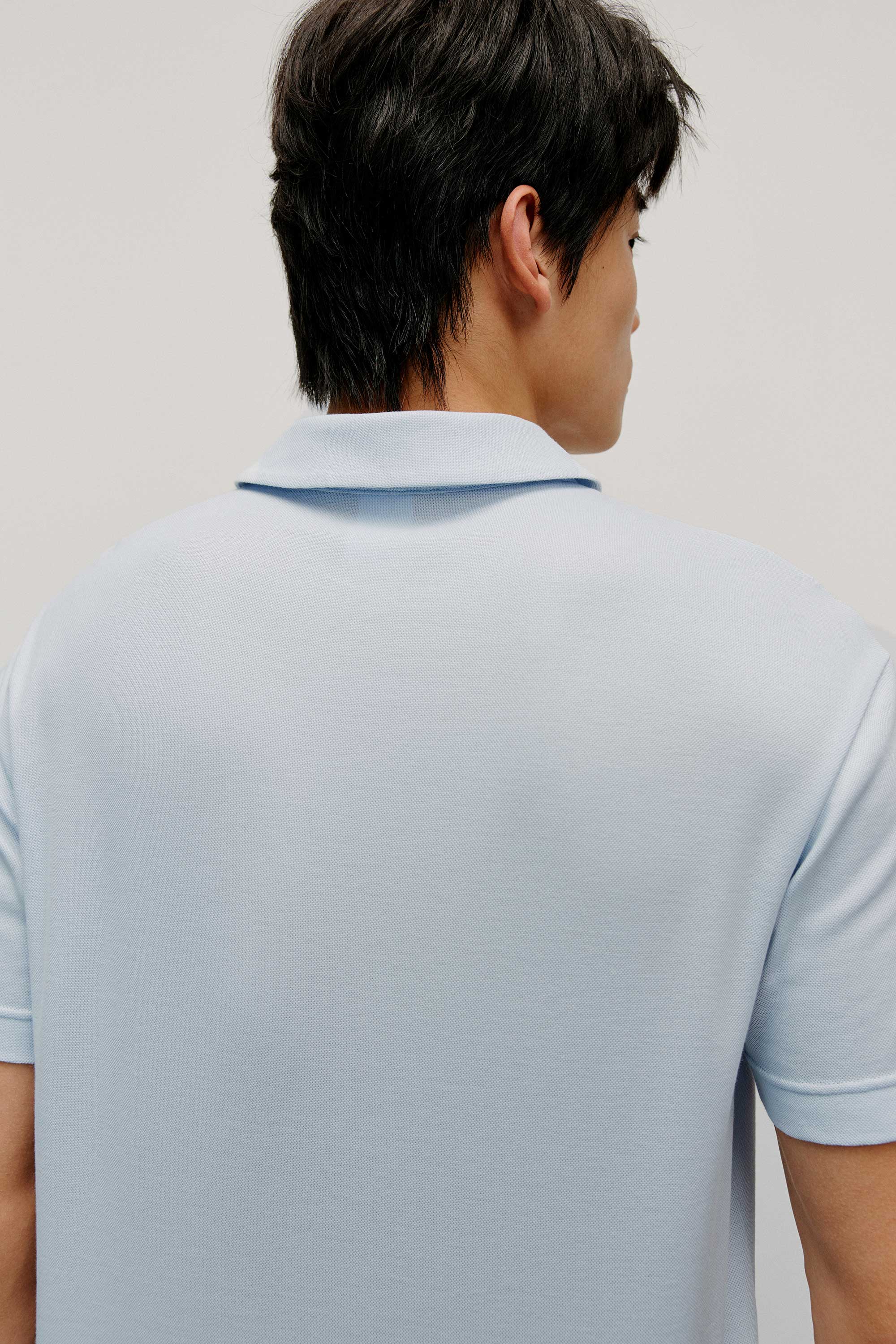 Man in blue polo shirt