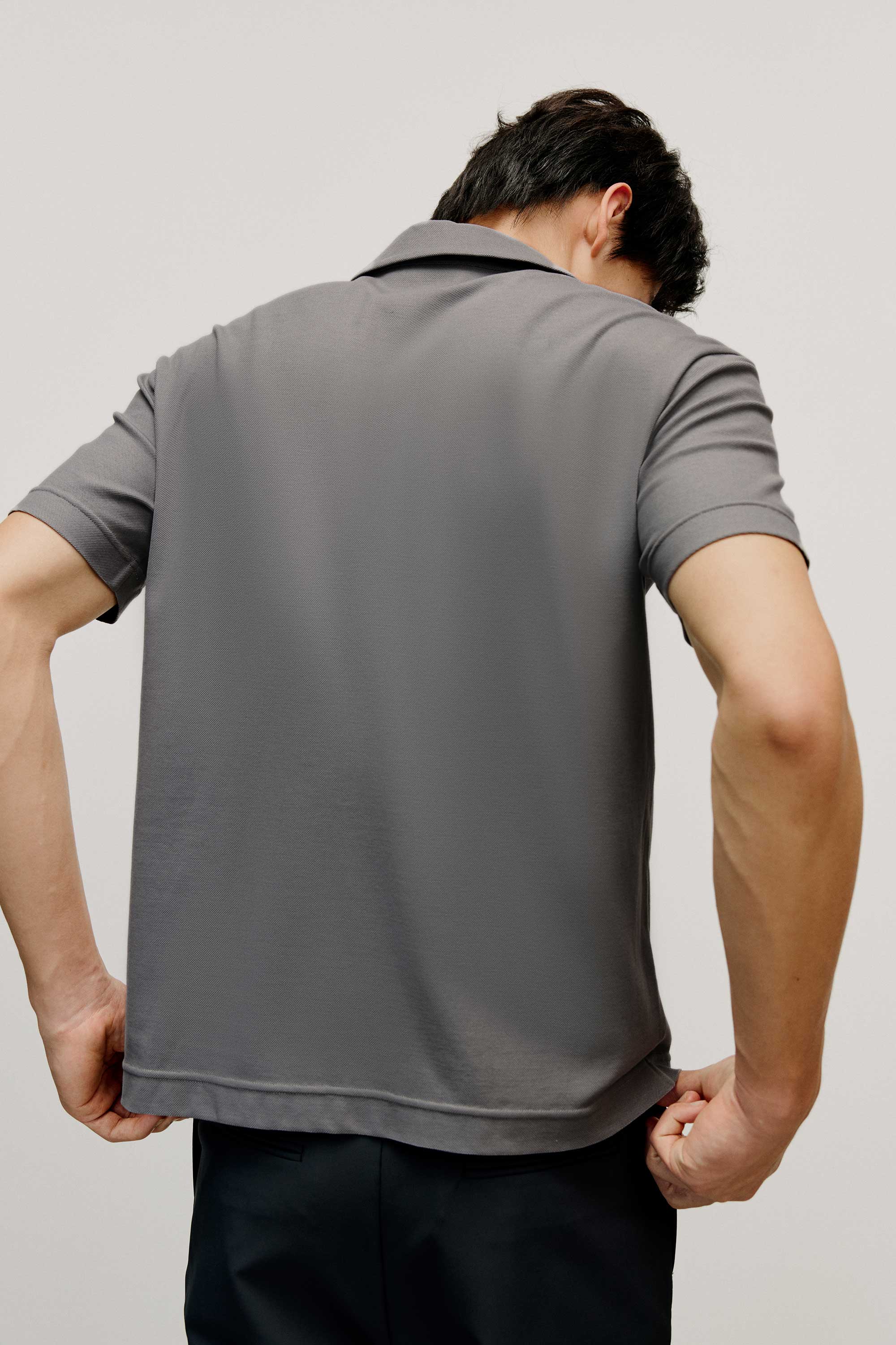 back of grey polo shirt