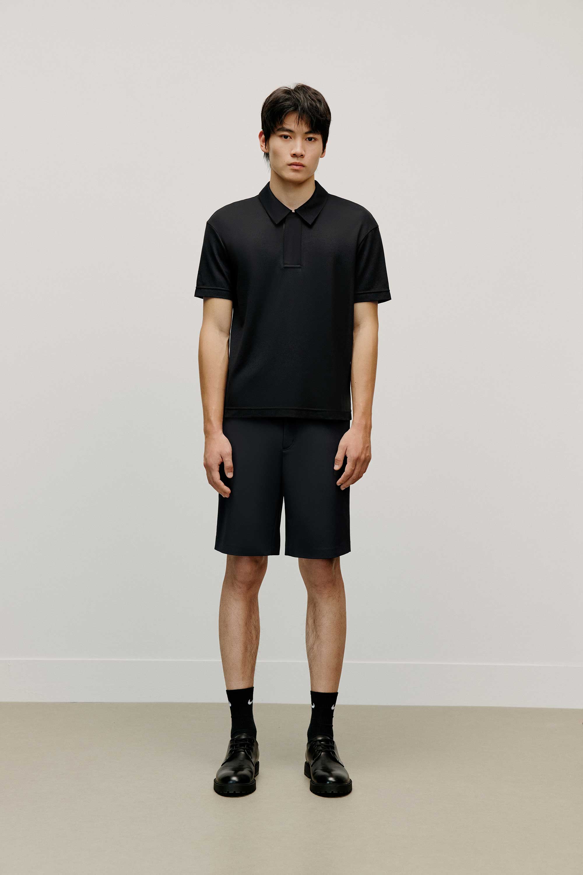Man in black polo shirt
