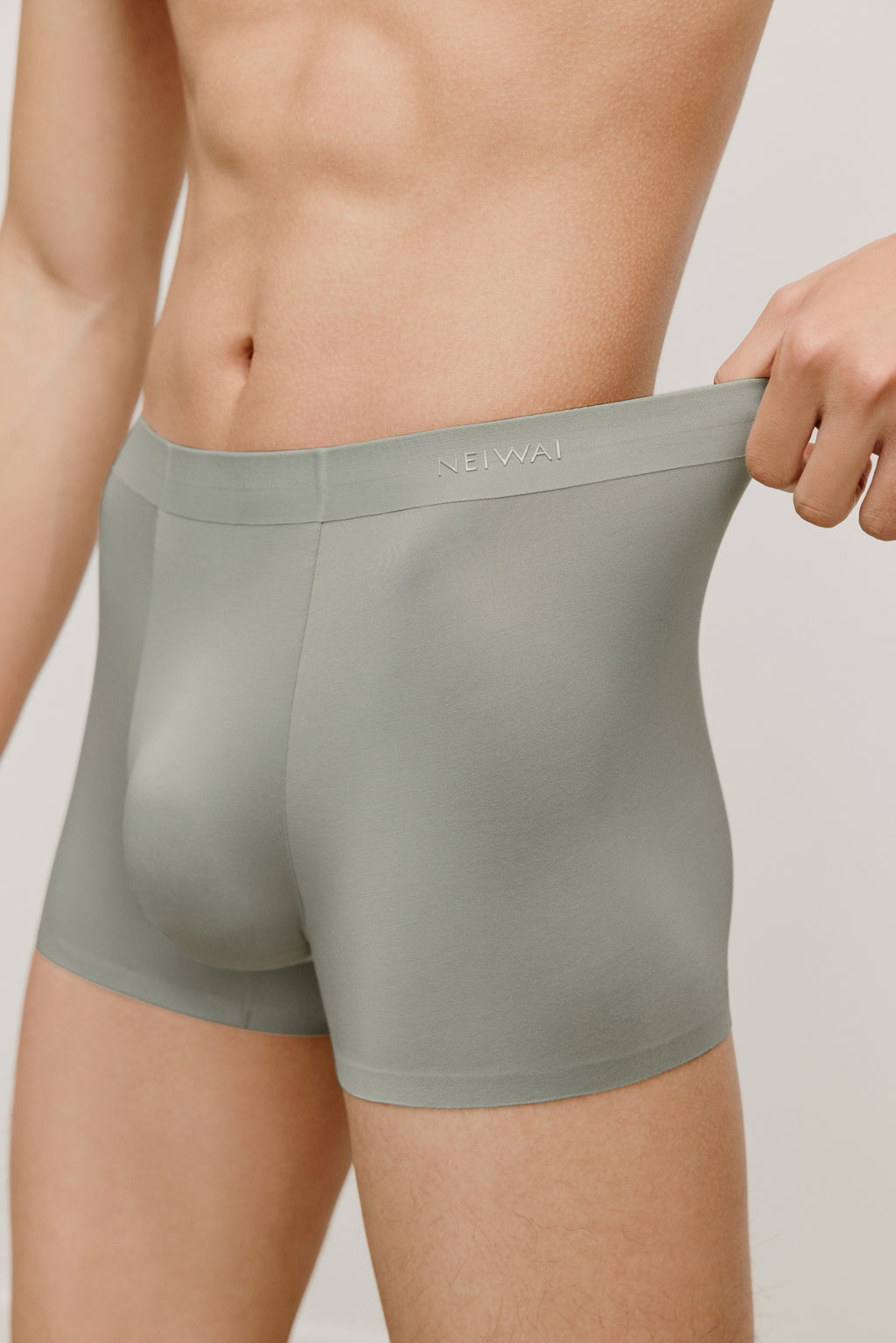 a man wearing a green brief