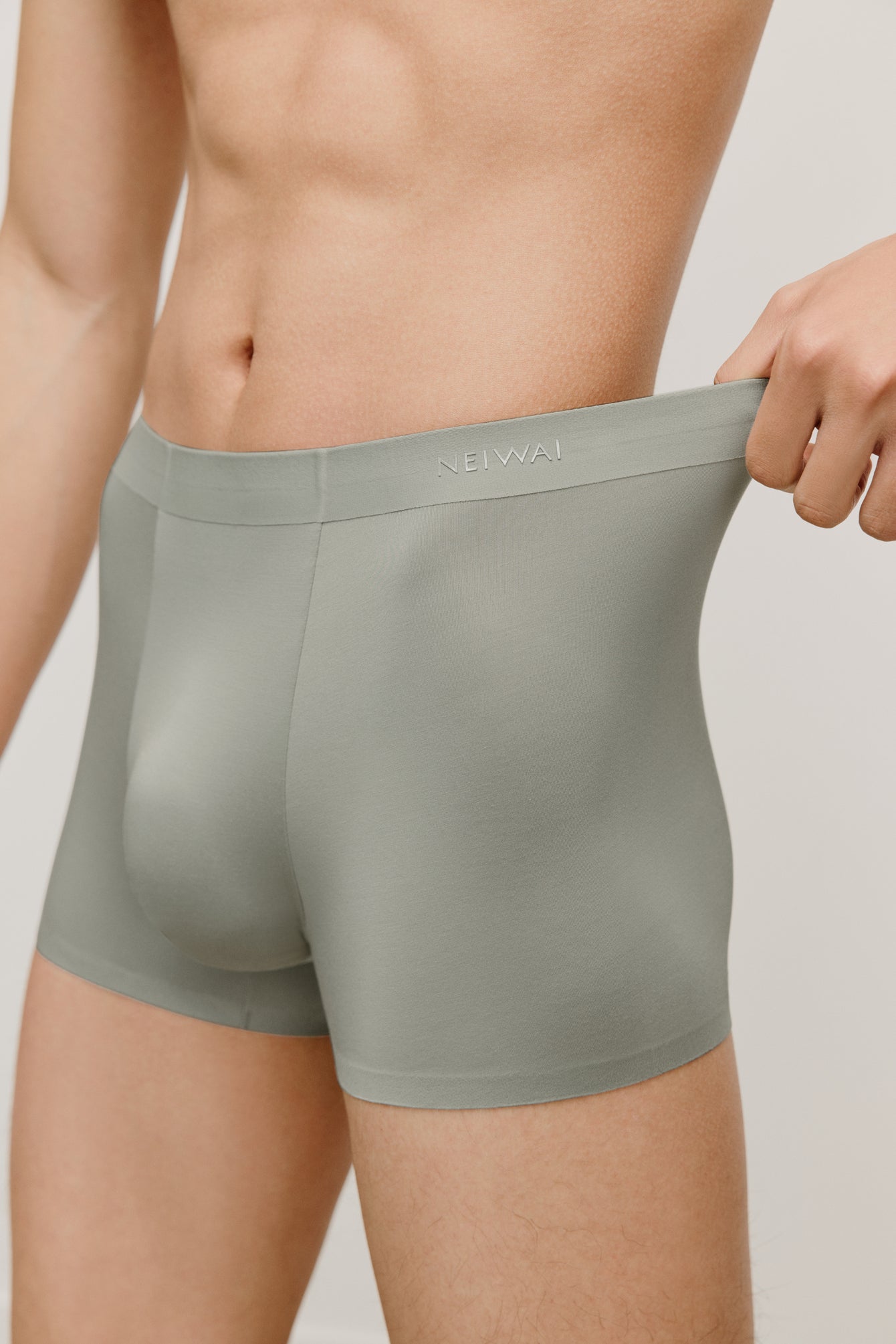a man wearing a green brief