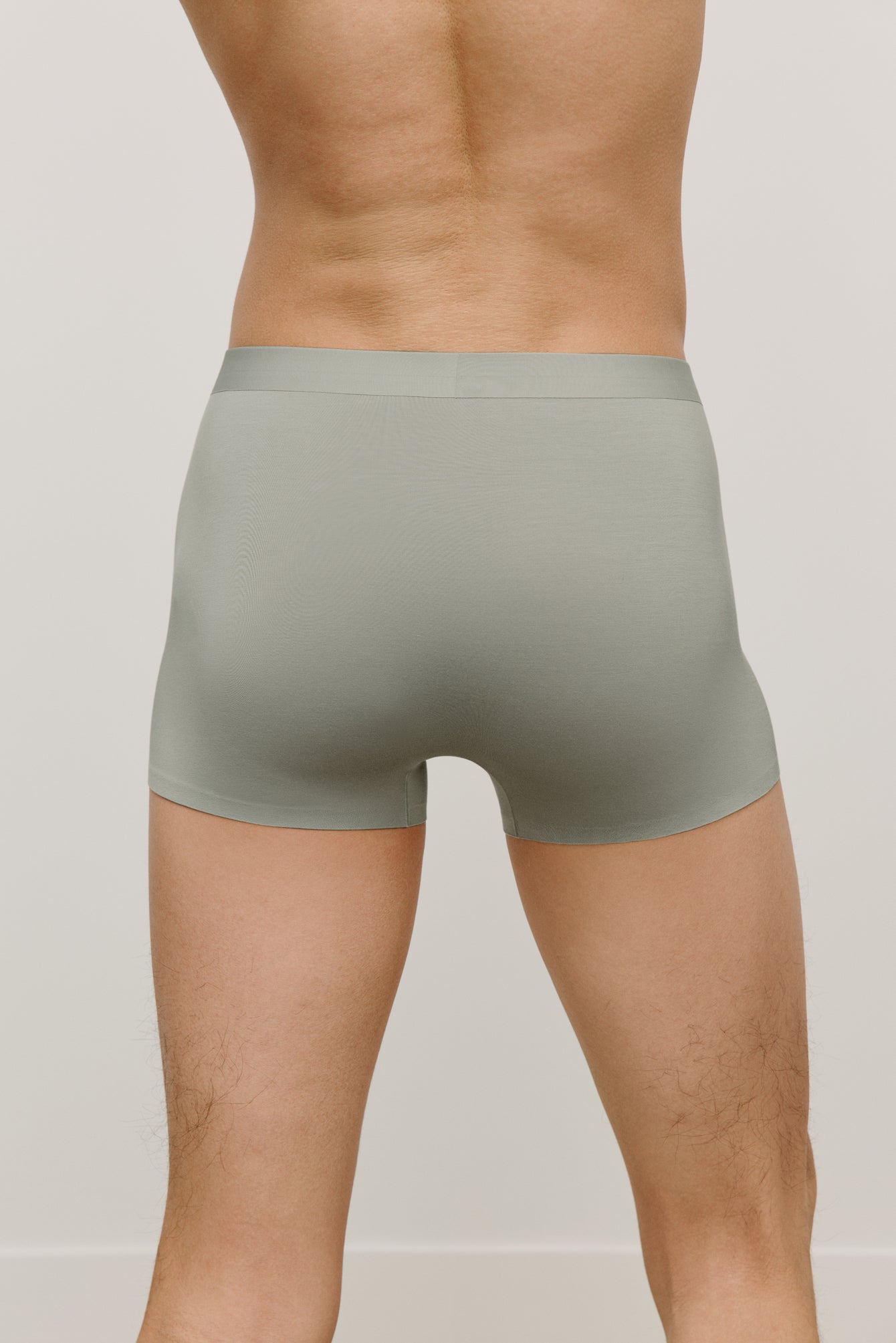 back of a man wearing a green brief