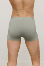 back of a man wearing a green brief