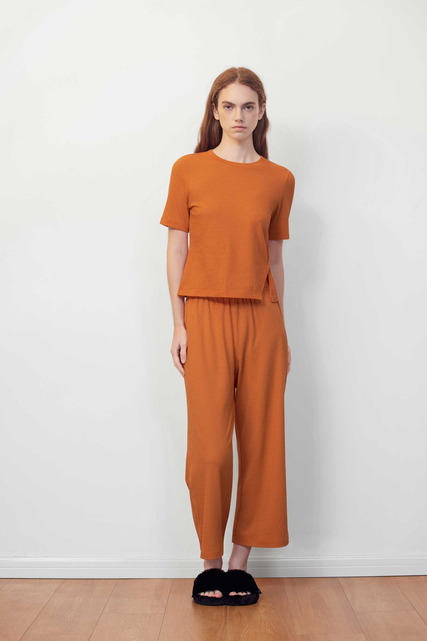 woman in orange T-shirt and pants