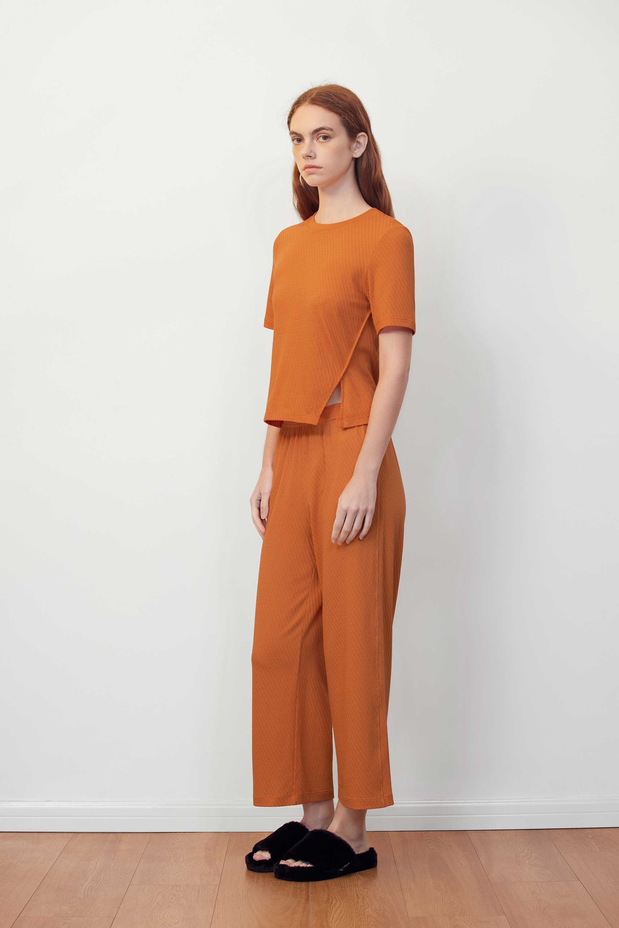 woman in orange T-shirt and pants