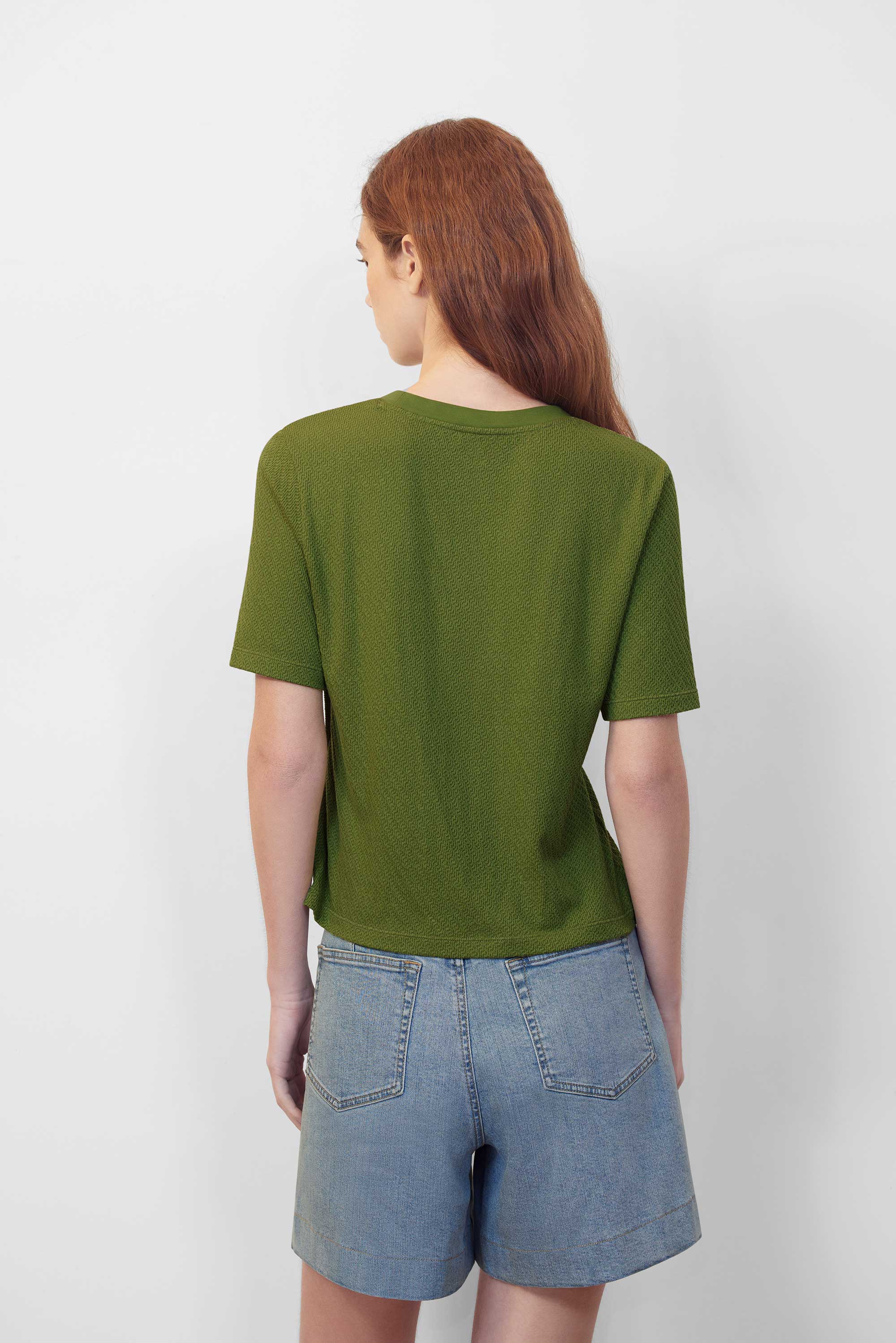 green T-shirt