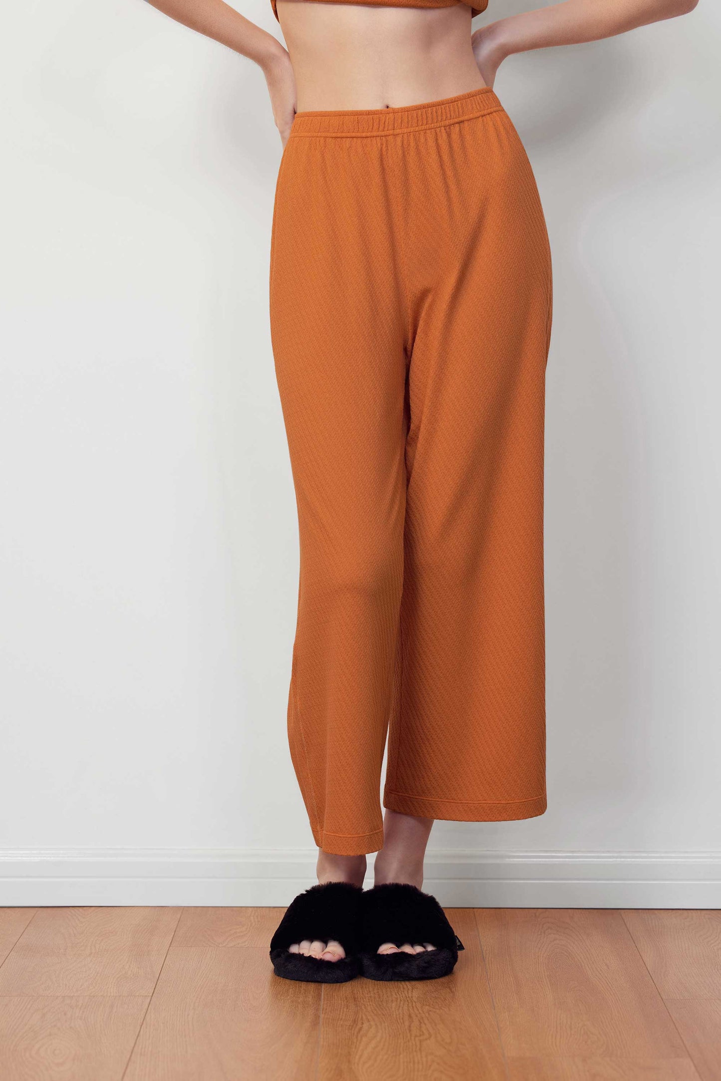woman in orange pants