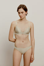woman in cream bra and brief