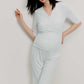 Pregnant woman wearing maternity V-neck top and pants