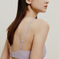 back of woman in light purple bra