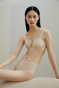 Woman wearing cream bra and brief