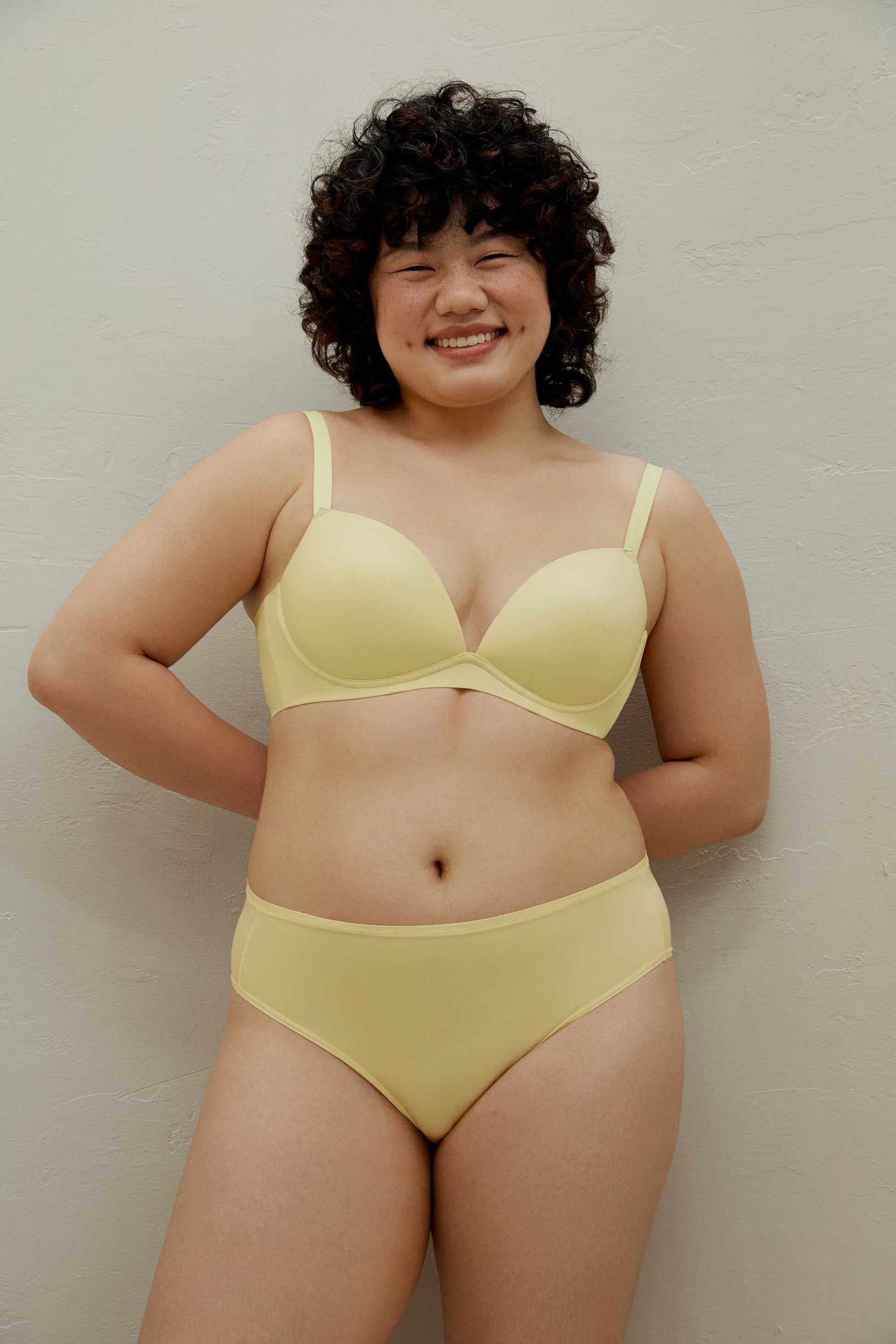 Woman wearing yellow bra and brief