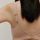 back of woman in nude bra