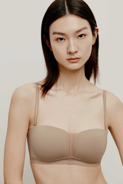 woman in tan color bra 