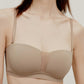 close up of woman in tan color strapless bra