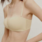 woman in cream color strapless bra 