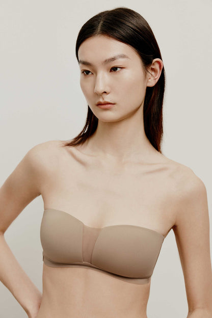 woman in tan color strapless bra
