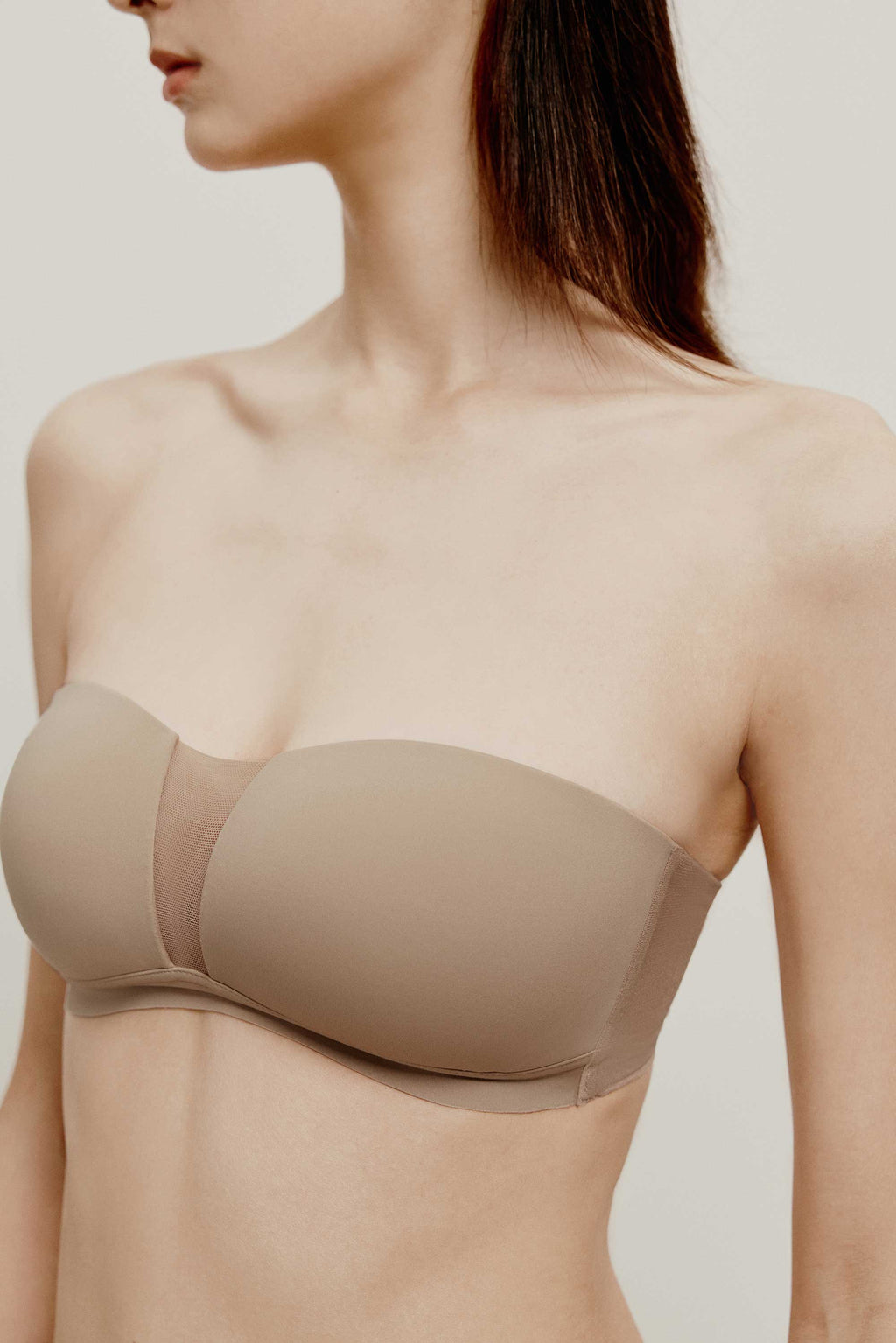 woman in tan color strapless bra