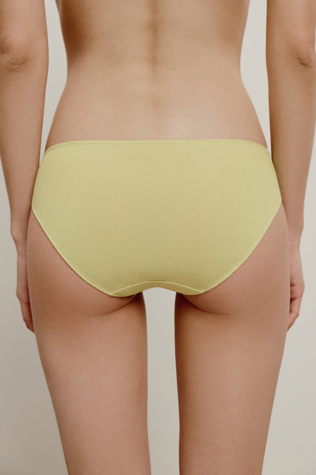 back of yellow low waist brief