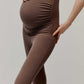 pregnant woman in high waist brown leggings