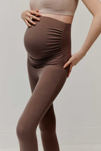 pregnant woman in high waist brown leggings